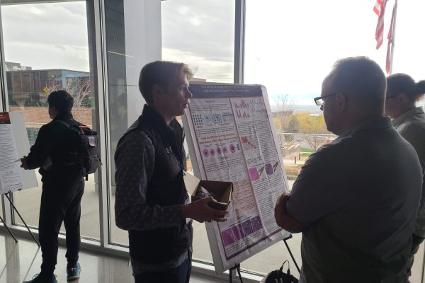 Jax presenting at the 2025 DELPHI symposium.